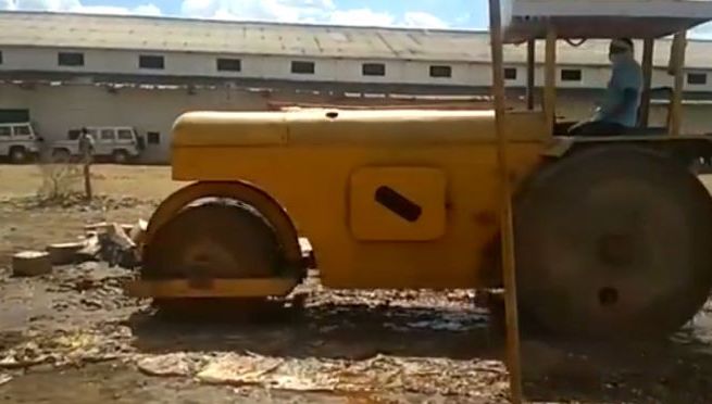 Look-at-here-Bulldozer-destroyed-almost-four-million-branded-alchohol