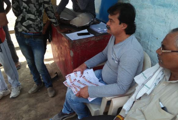 Voter-slip-with-photo-of-BJP-candidate-and-PM-Modi-distributed-to-voters-in-jabalpur
