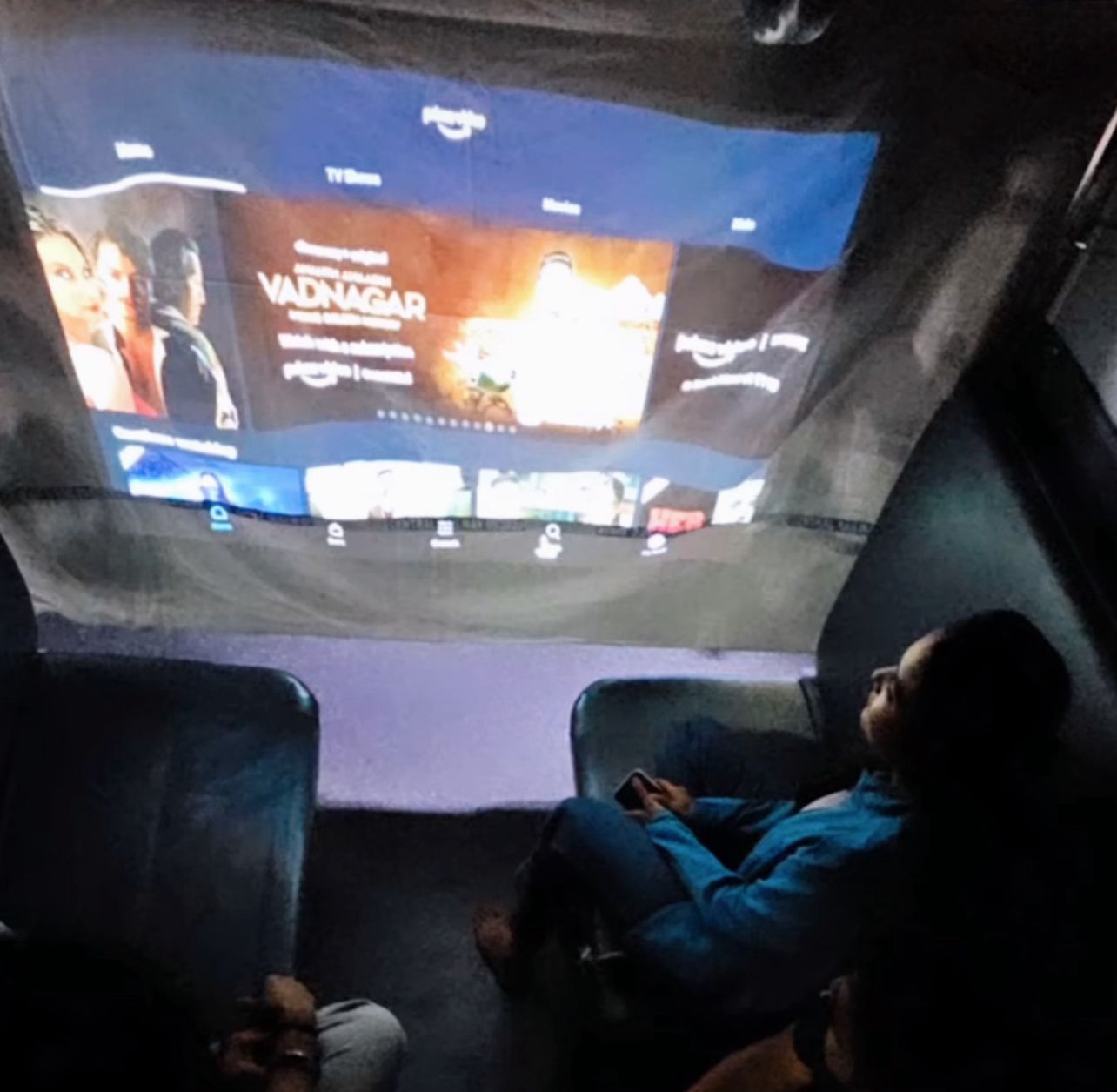 Film played from projector in train compartment