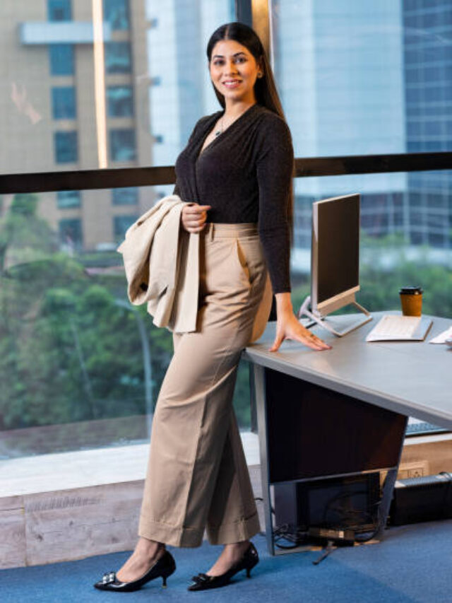 Portrait of a young woman standing in an office